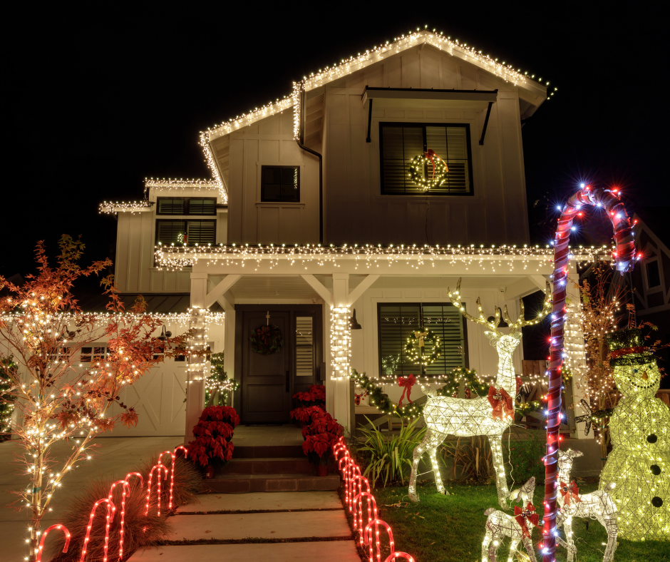 A house with Christmas lights and yard displays