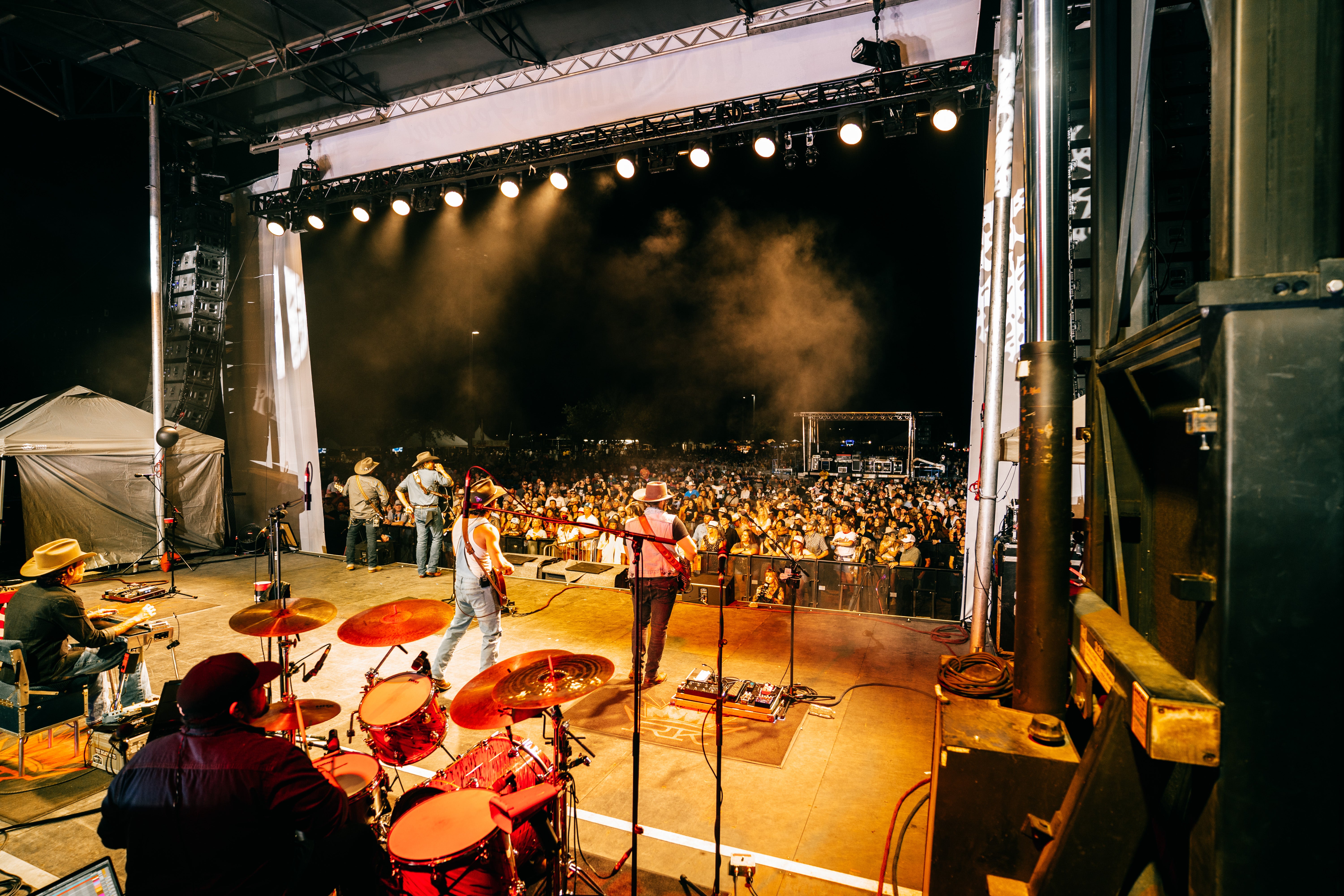 A crowd enjoys a music performance at the Troubadour Festival