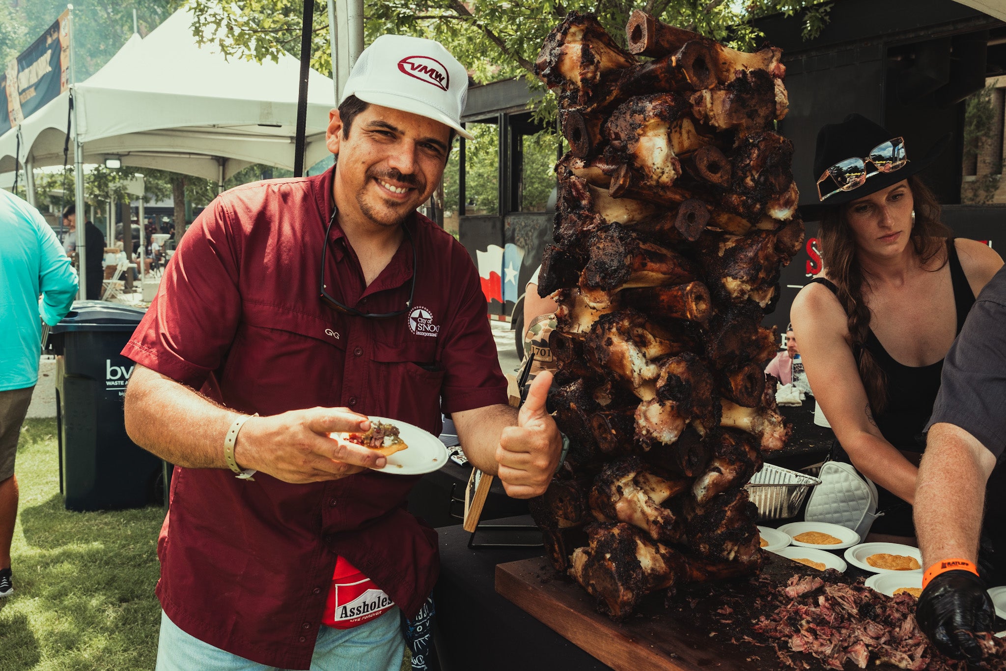 A man enjoys a sampling of Texas barbeque at the Troubadour Festival